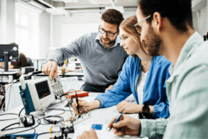 Students at a vocational school working on electrical tasks.