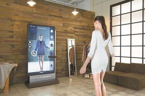 woman in white dress standing in front of augmented reality fitting room screen trying on a purple blazer dress. In a room with a couch and wooden wall and mirror
