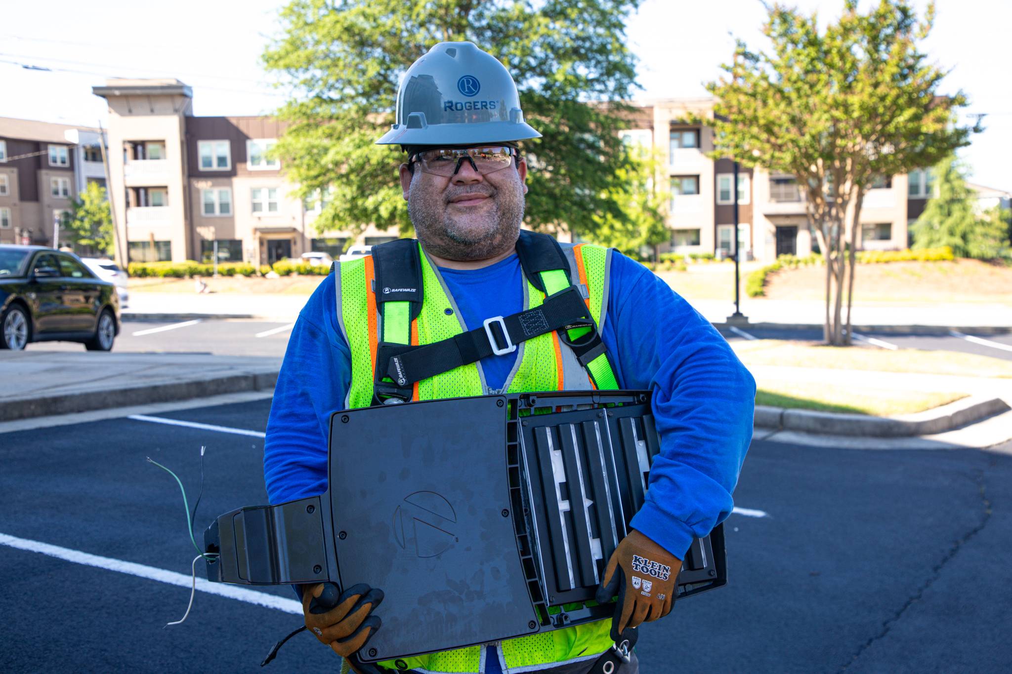Roger's technician holding light fixture.