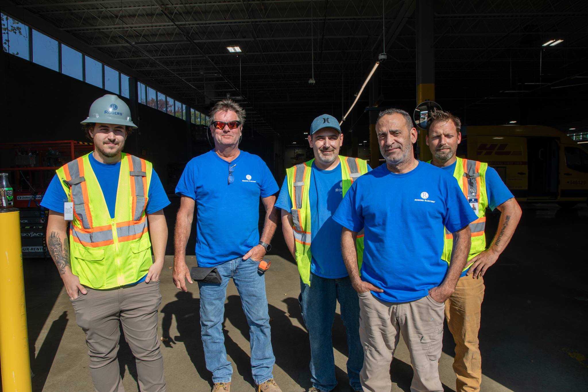 5 Rogers Electric electricians smiling for the camera on DHL jobsite