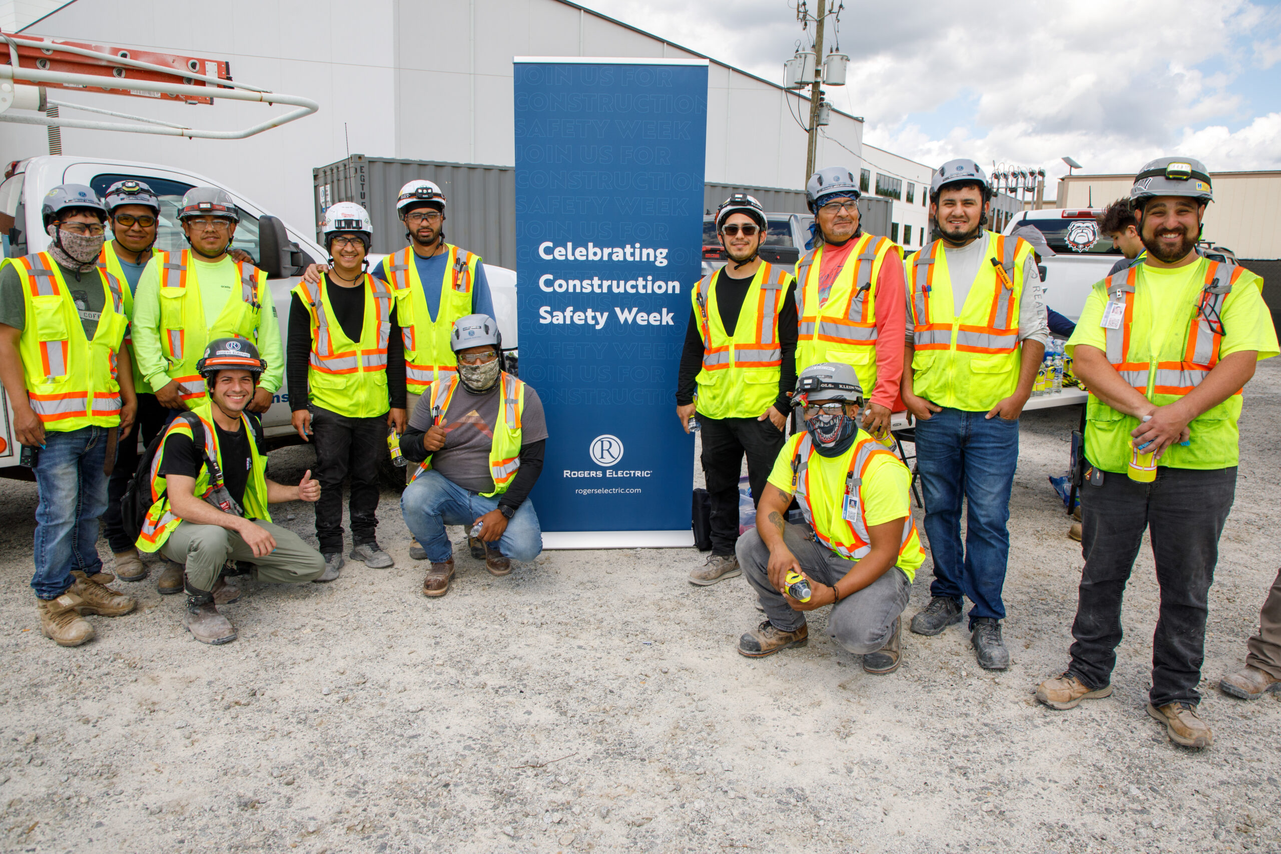 electricians smiling and posing for construction safety week