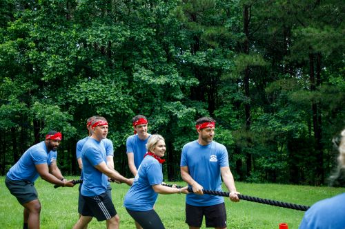 Rogers Electric employees playing tug-of-war.