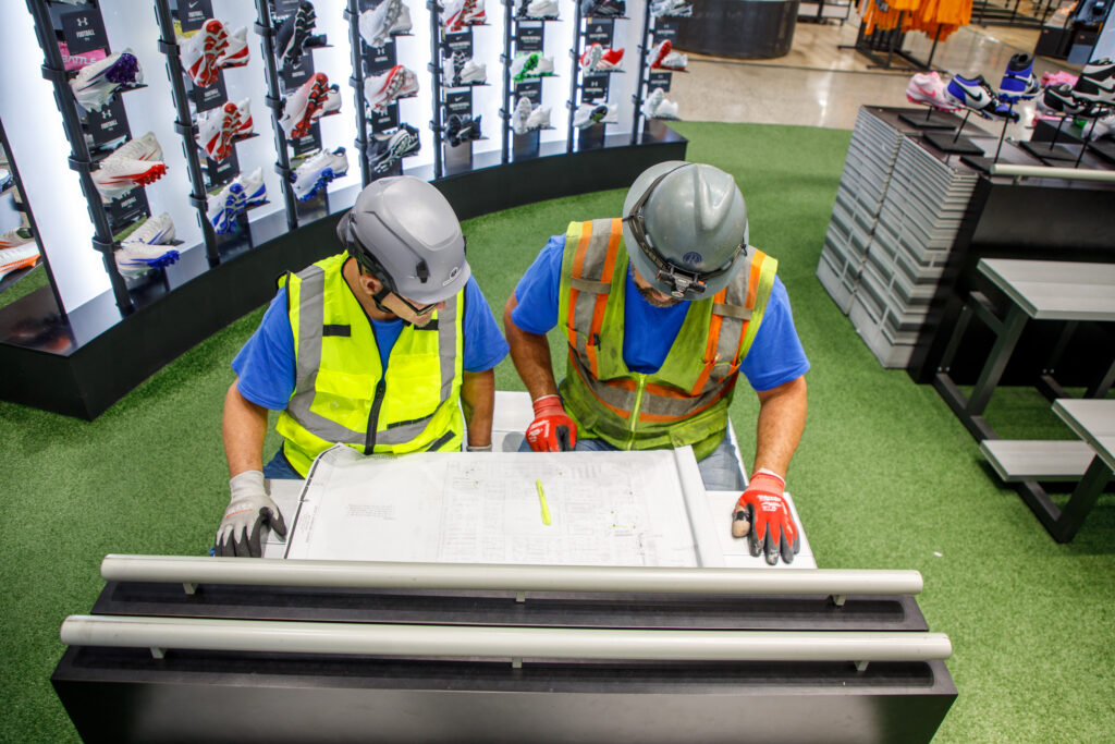 Electricians mapping out electrical systems that support sustainable building design