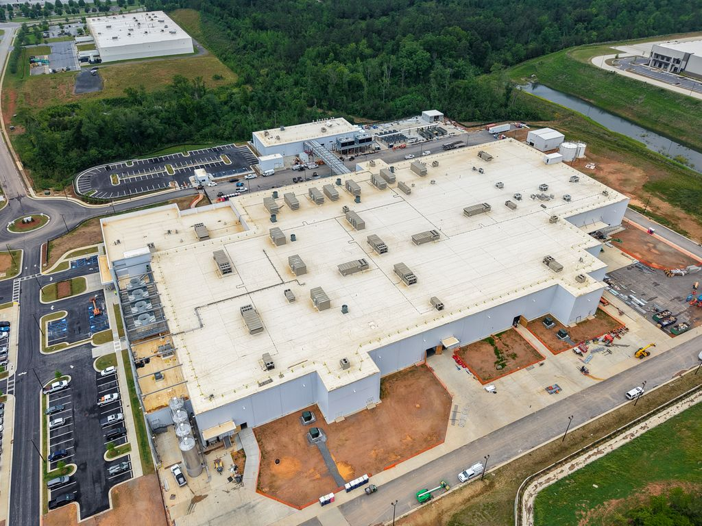 Large commercial building designed with resilient electrical infrastructure and preconstruction planning to help withstand severe weather and reduce operational disruptions.